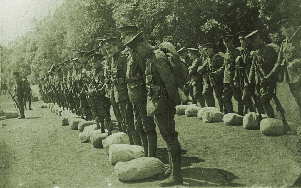 First World War soldiers line up ready to be deployed.